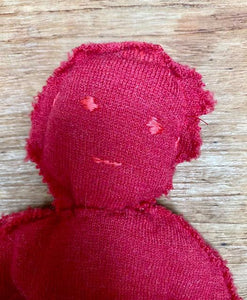 Red circulair doll made from a recycled pullover 100% wool