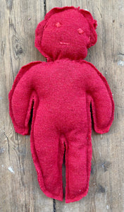 Red circulair doll made from a recycled pullover 100% wool